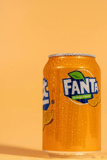 an orange can with fanta written on the side