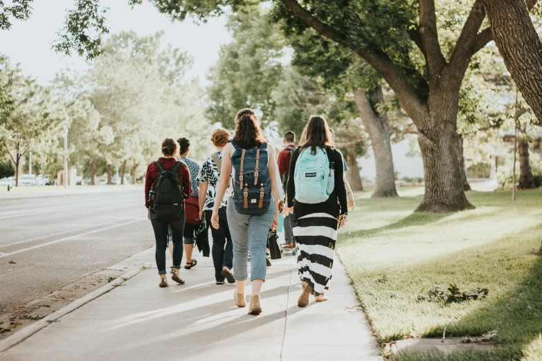 a group of people that are walking down the street