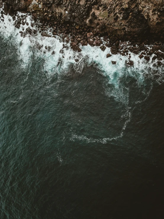 a very large wave about to break near the shore