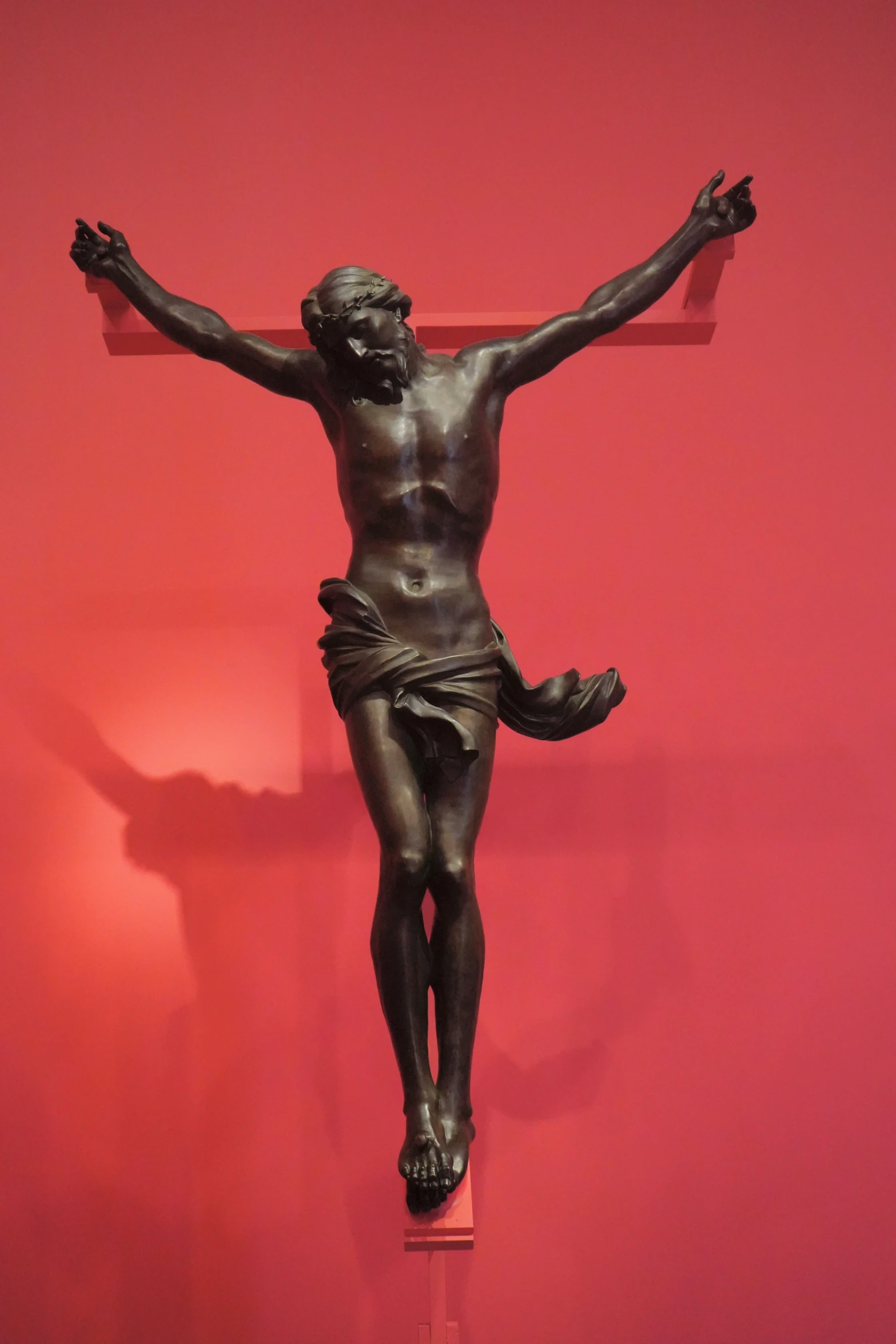 an antique bronze sculpture of a crucifix
