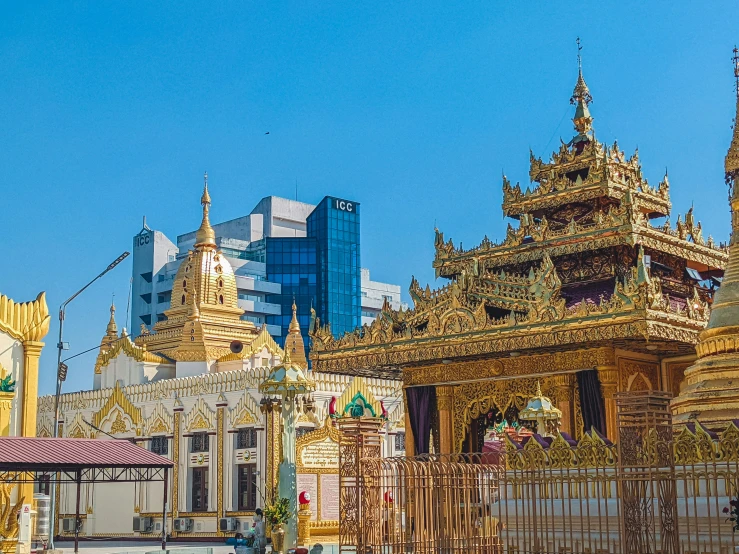 the pagoda that looks like a shrine is surrounded by buildings