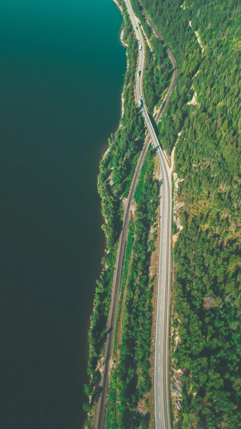 the aerial view of a road on a mountain