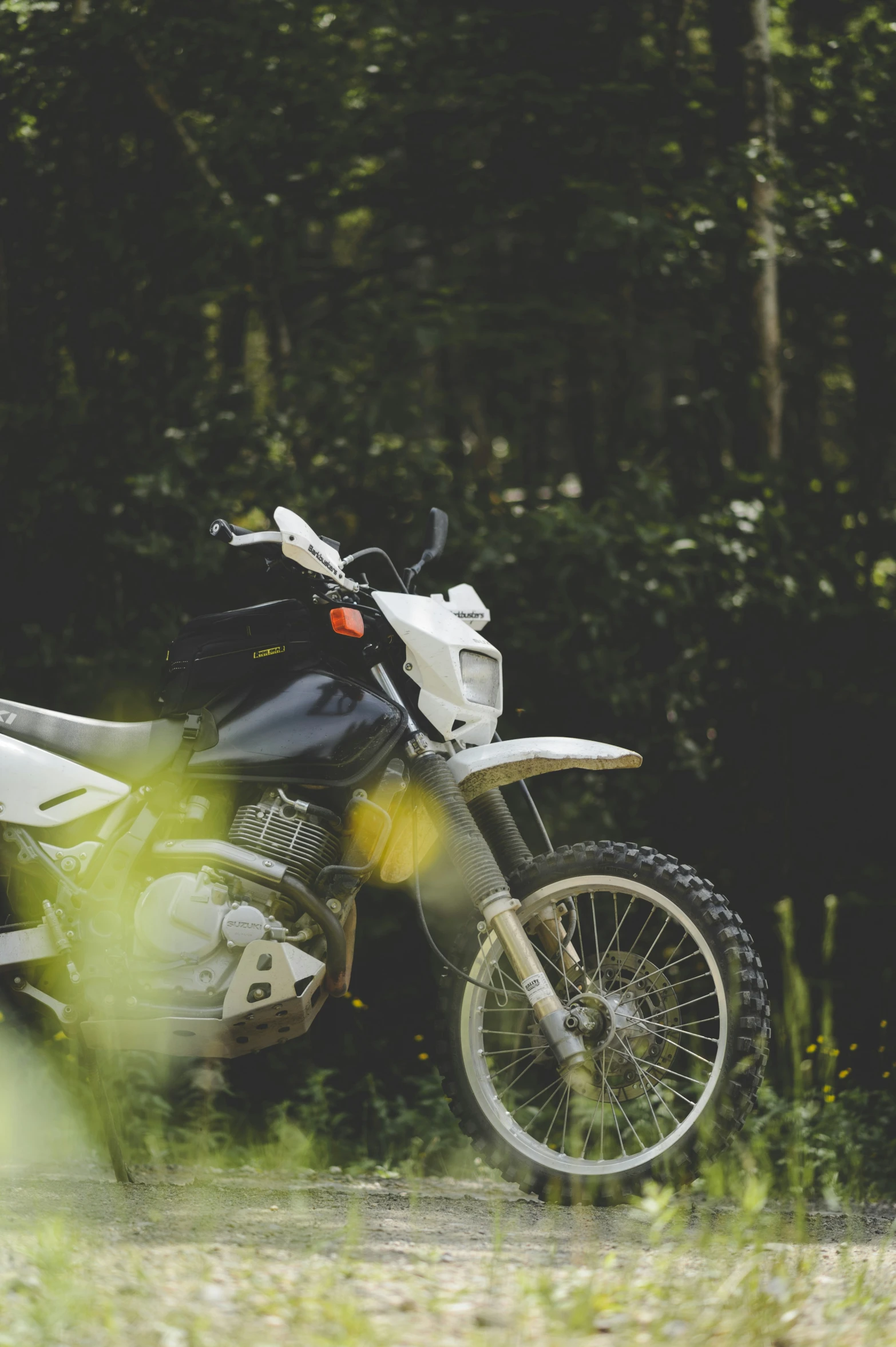 a dirt bike is sitting on a path