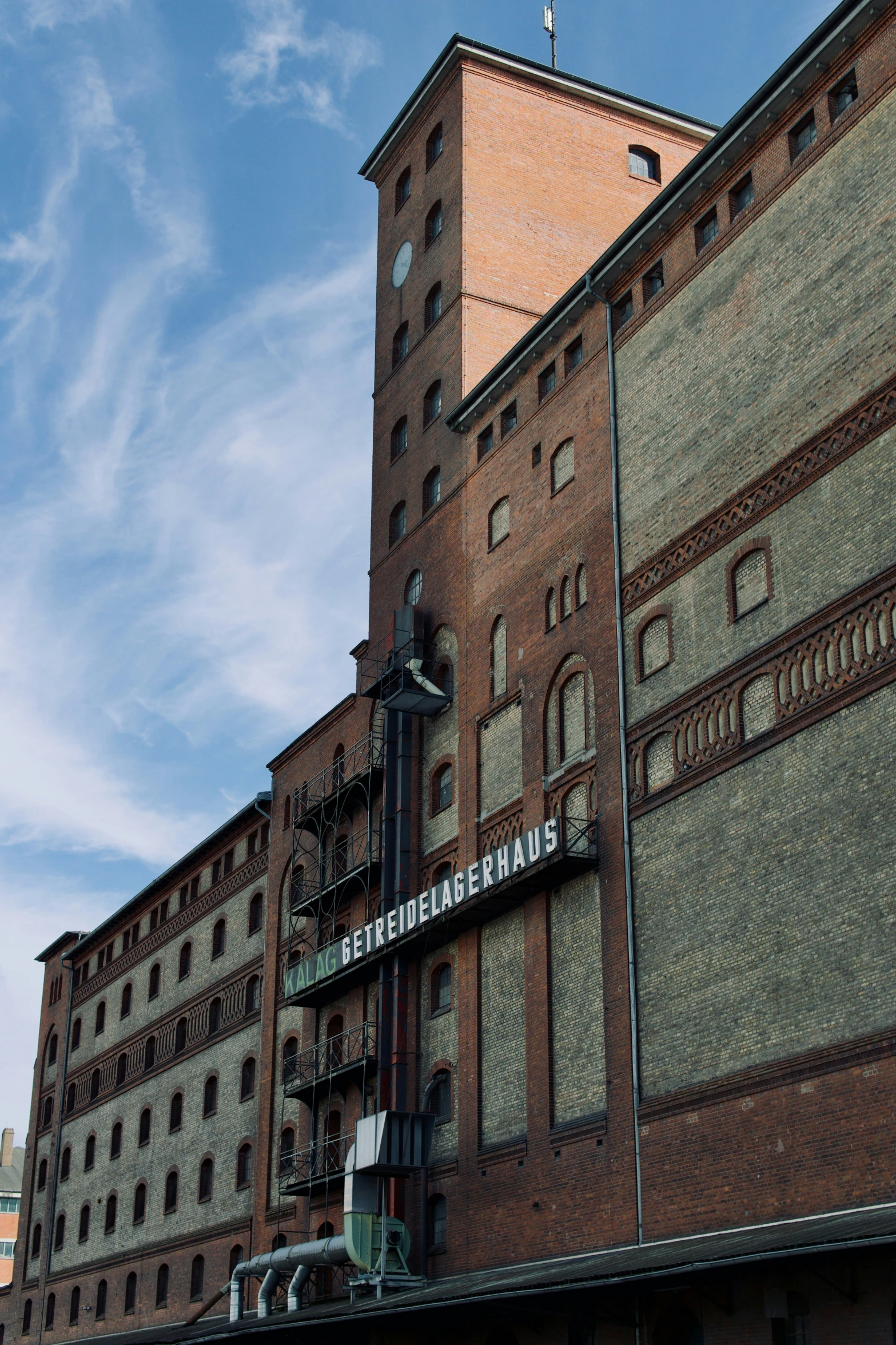 the building is made of brick and has a clock at the top