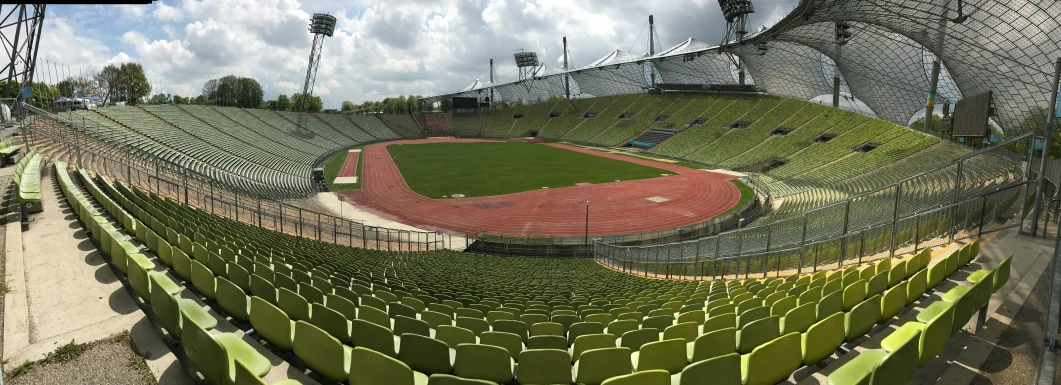 a baseball field with seating for up to 10, and a view of the stadium