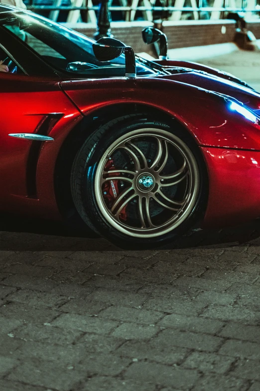 the front wheels of a sports car with chrome rims