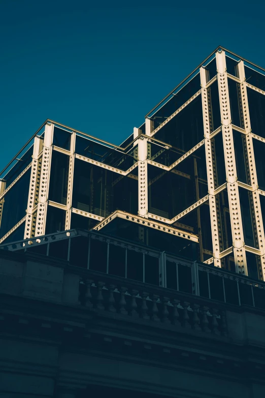 tall buildings against the dark blue sky with metal piping