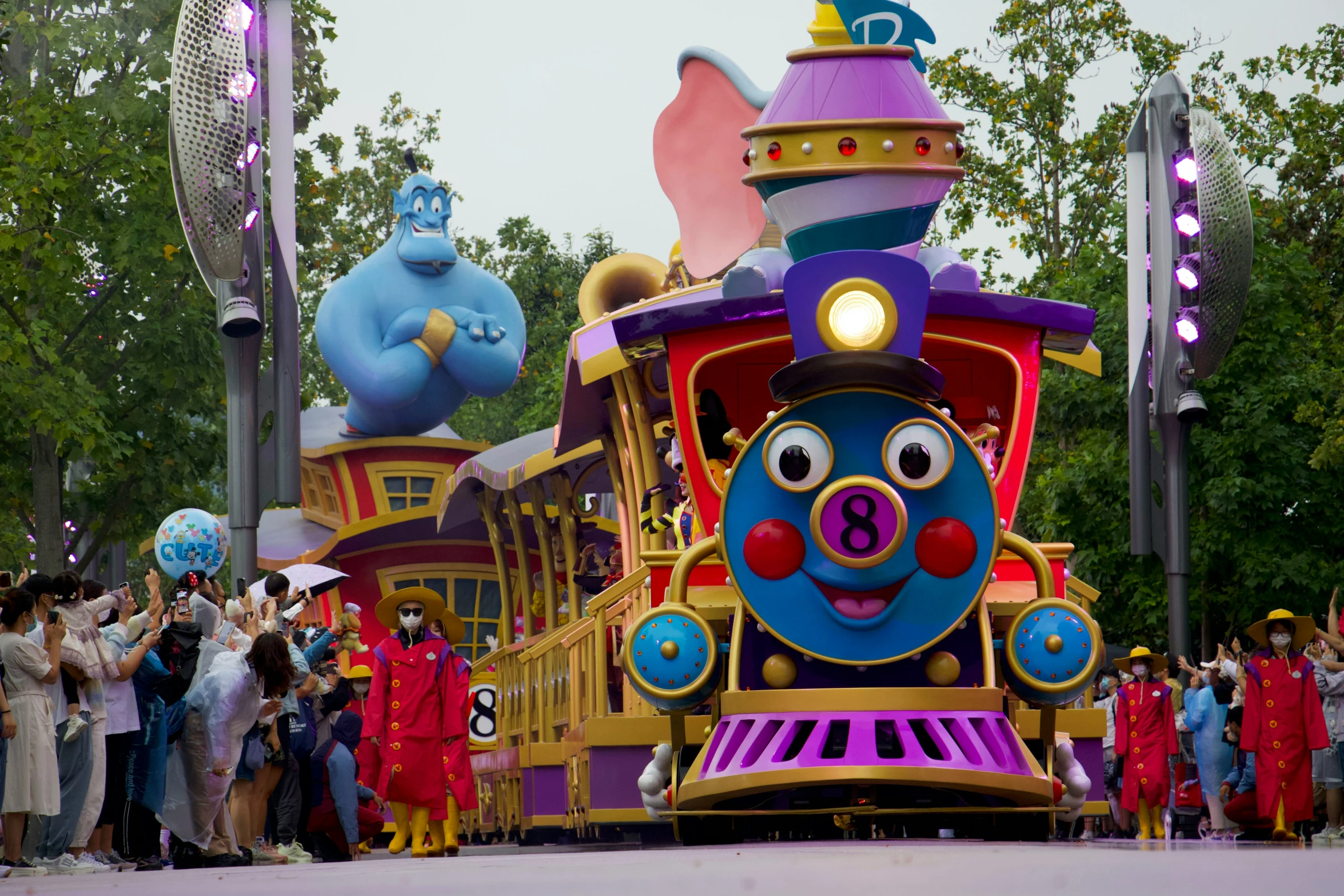 a group of people gathered around a thomas the tank