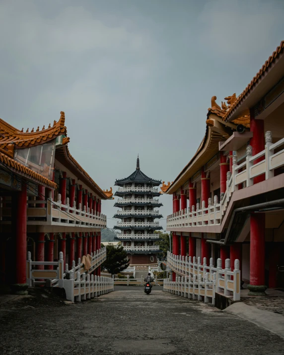 the courtyards with chinese architecture and a car parked nearby