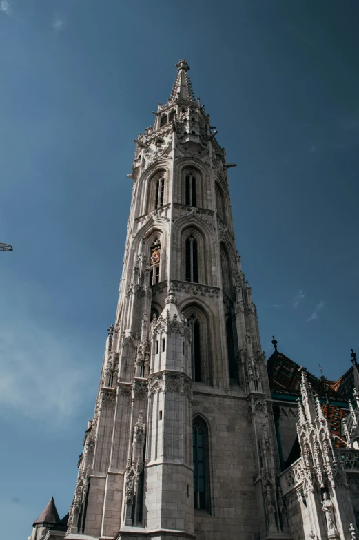 a large gray building that has a clock on it