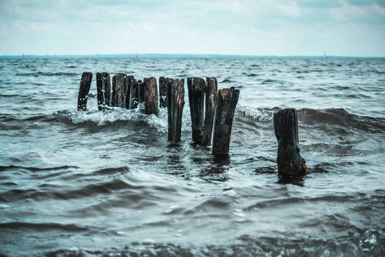 a pier sitting in the middle of a body of water