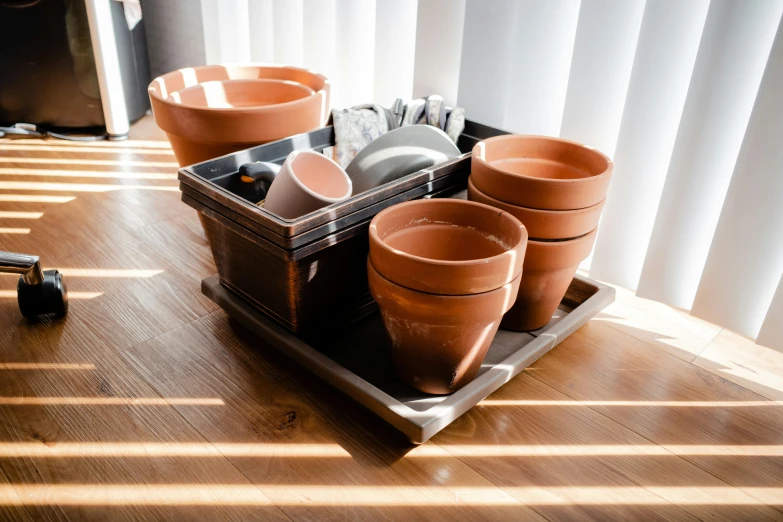 the table is covered with dishes and cups