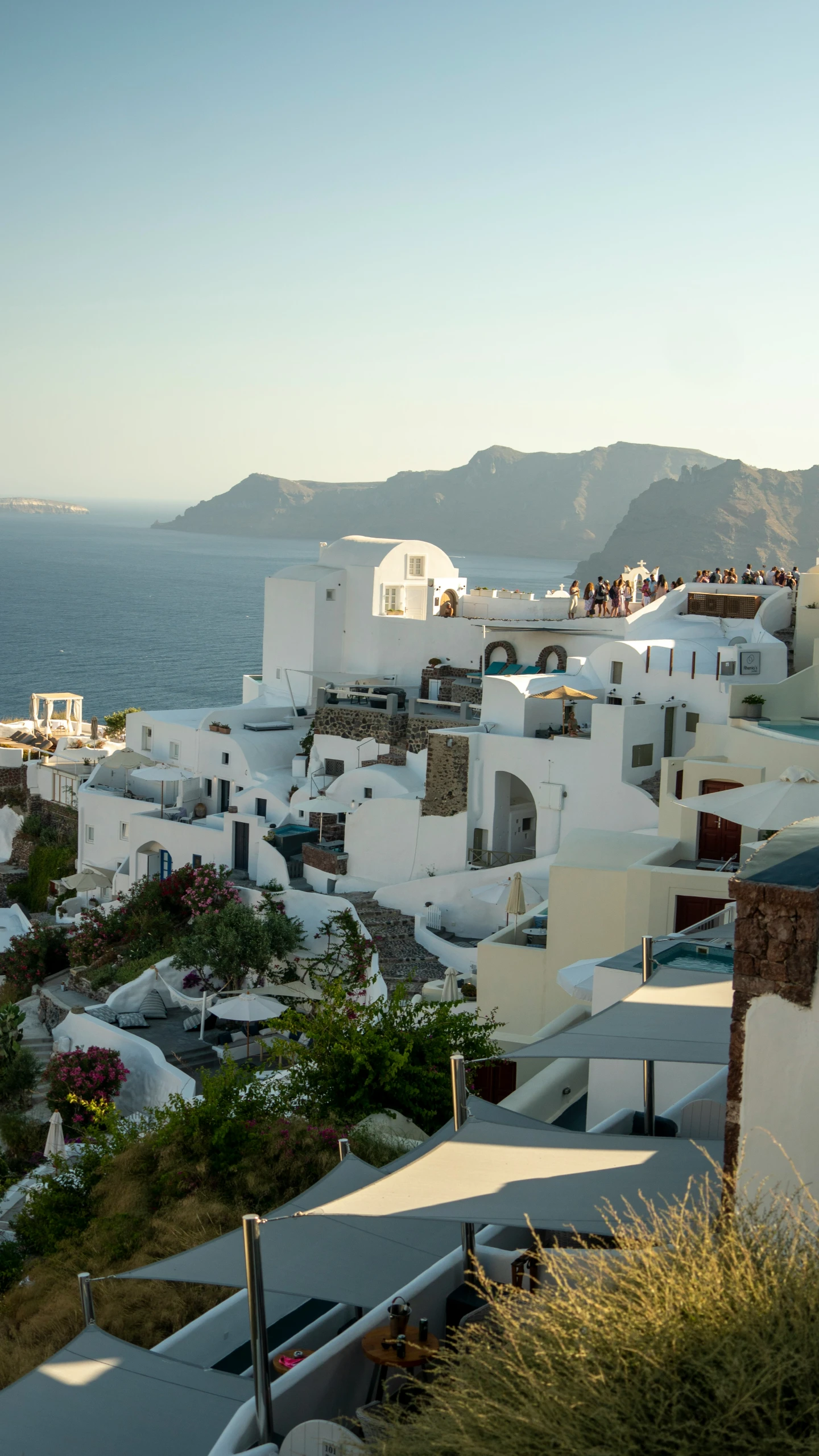 a view of a city and mountains across the water