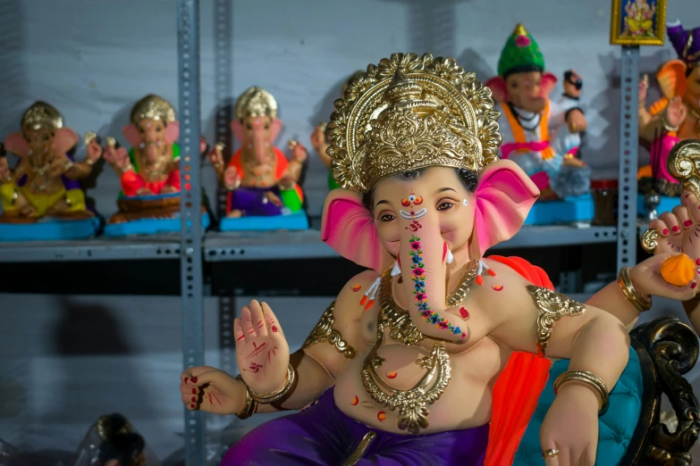 a statue of an elephant is sitting in a row