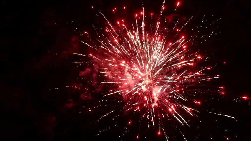a dark view of a fireworks with bright colors