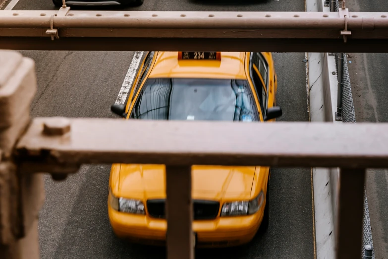 view from the ground of cars on street with traffic