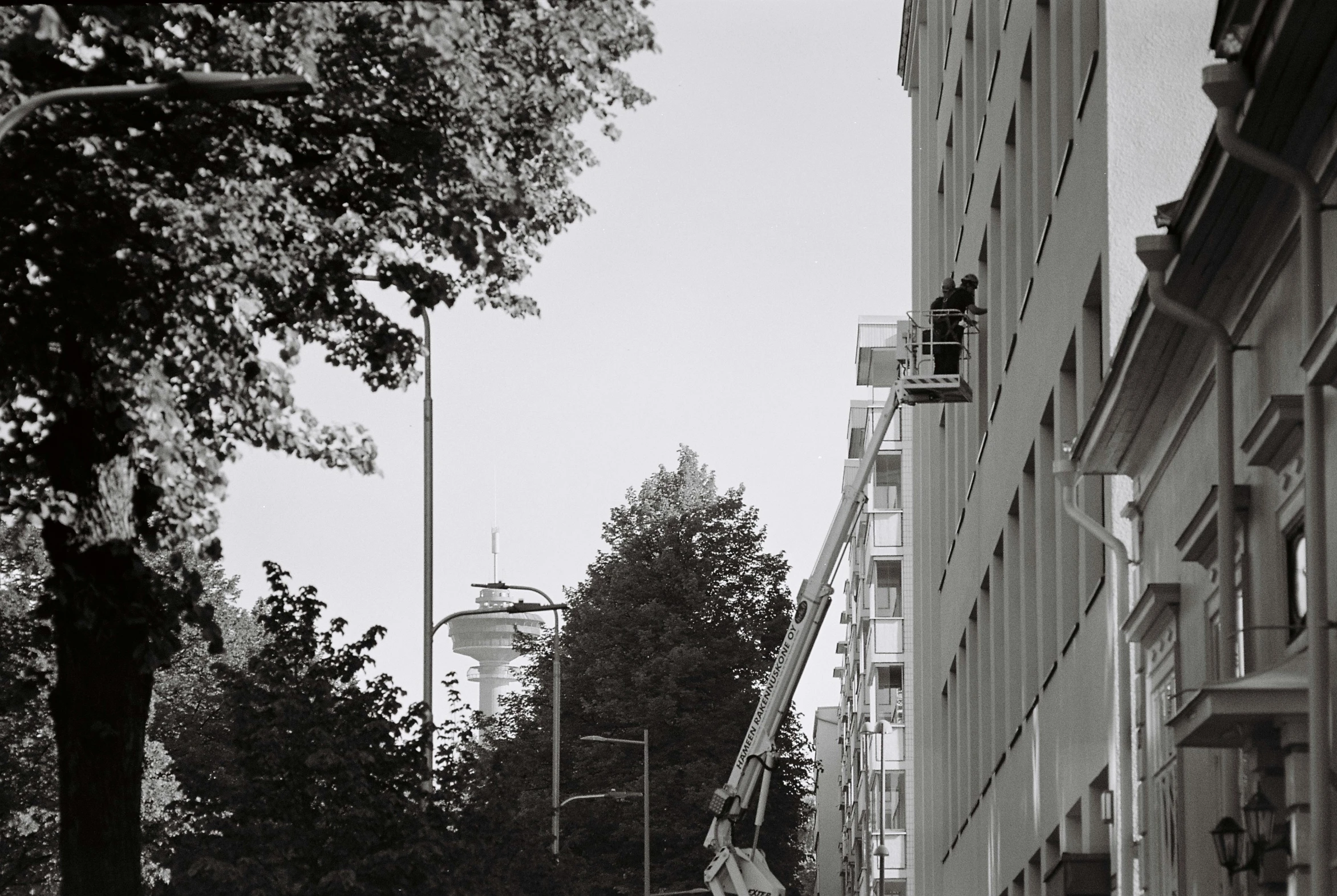 several buildings and a street light on a city street