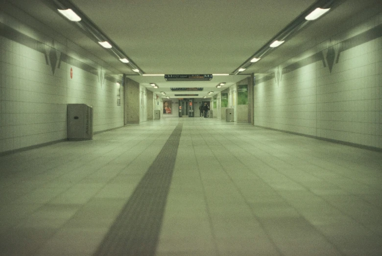 a hallway with light fixtures and shadows