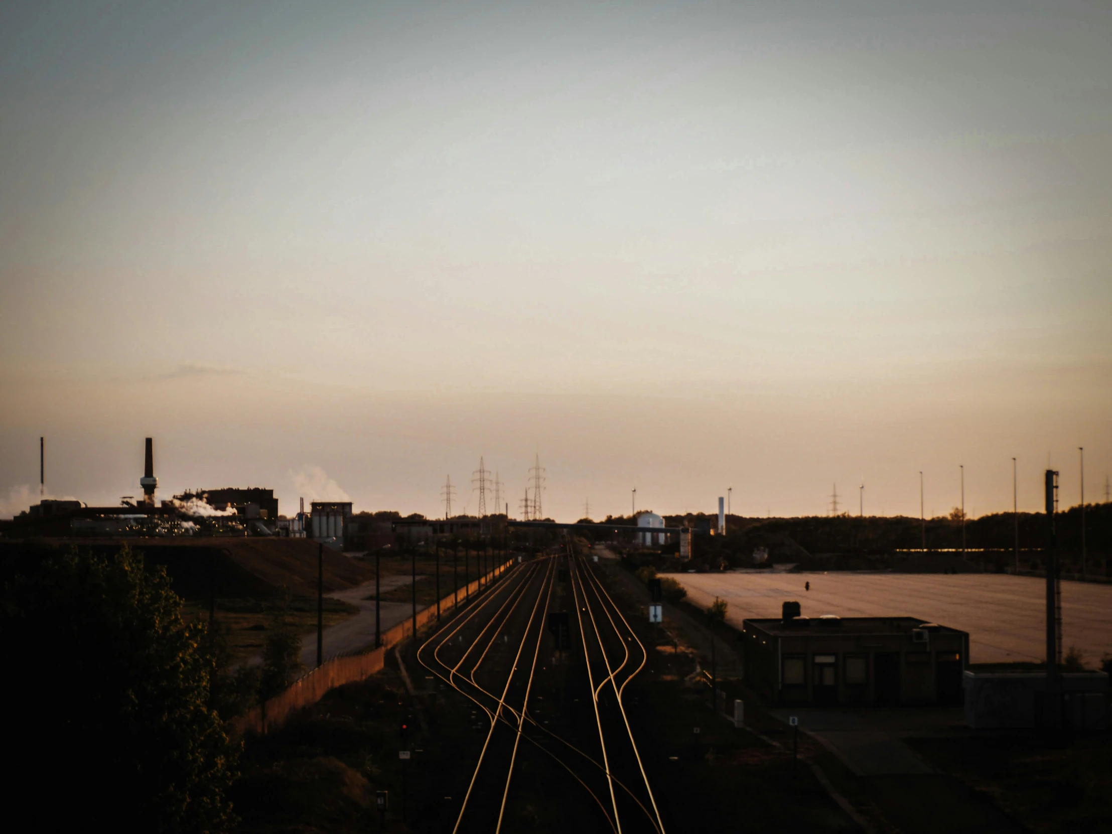 there is a railroad crossing in the distance