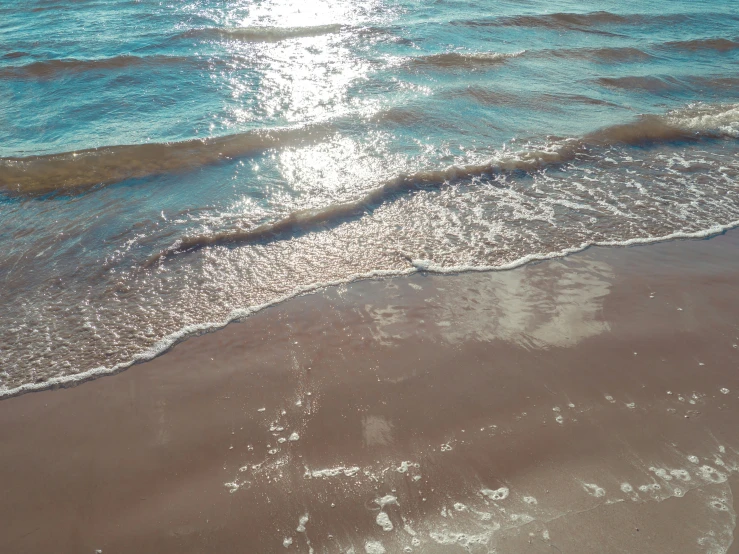 a beach with some water in it and the sky