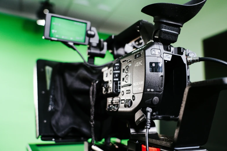 a camera on top of a tripod and two camera devices