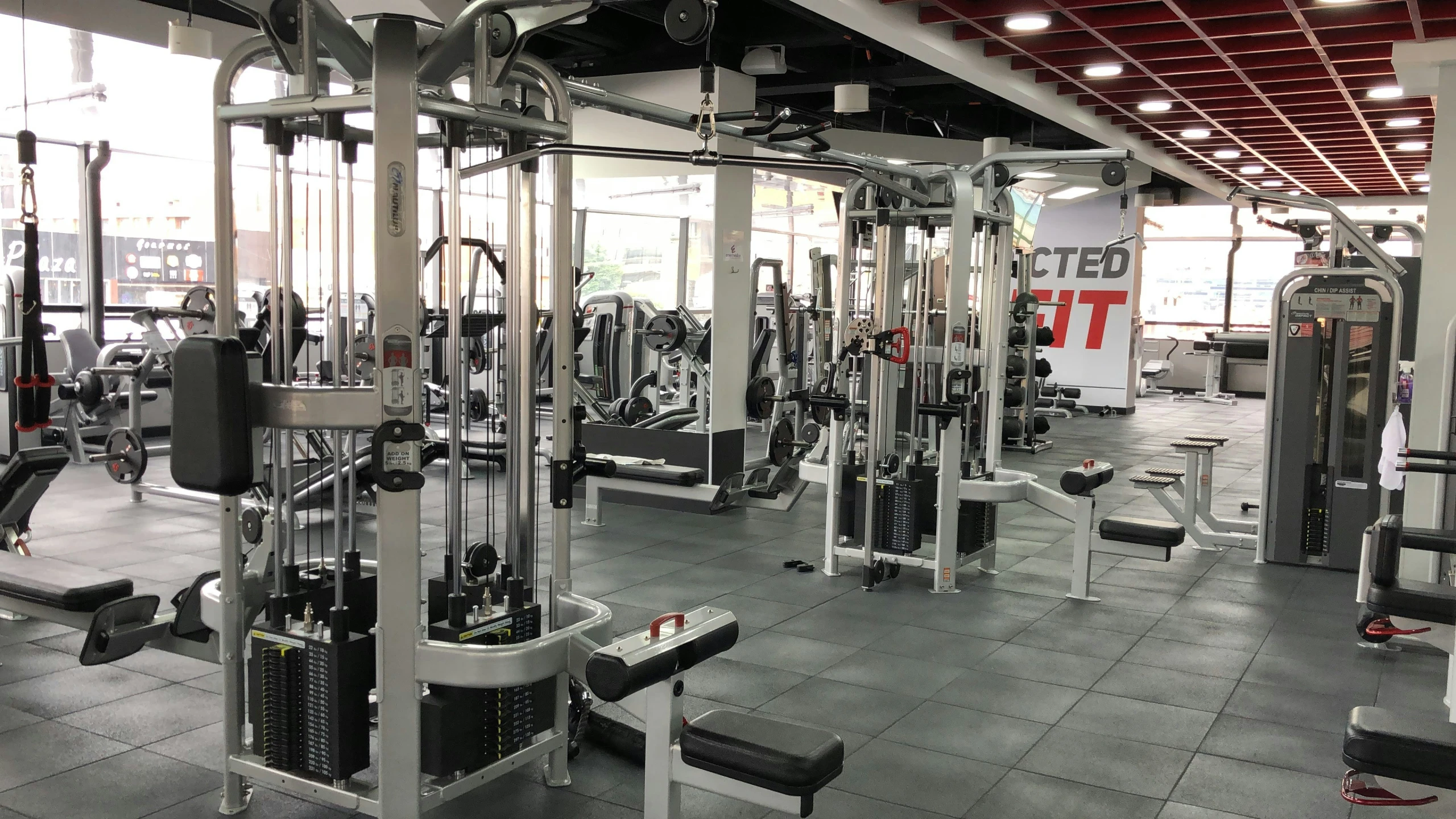 a gym is shown with rows of machines