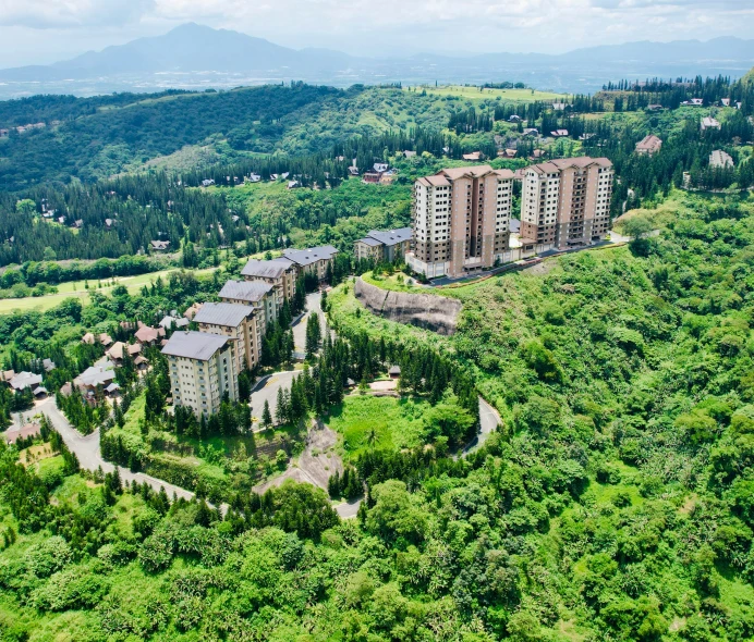 the building on the hillside is very tall and there is no visible people