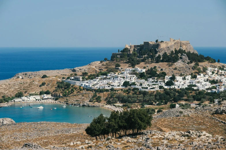 a view of an island with buildings and water