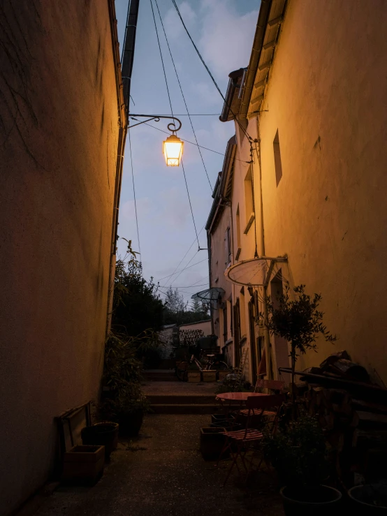 a street scene with a light hanging from the side