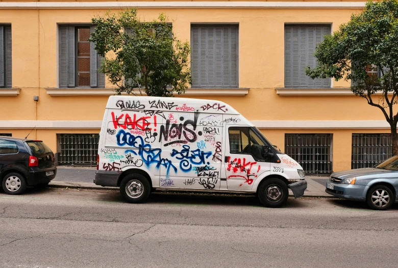 the van has graffiti written on the side of it