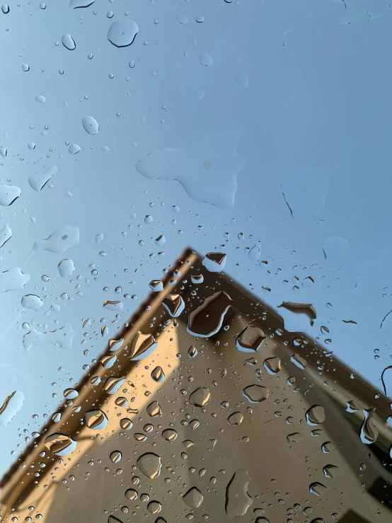 rain is seen on the window of a car