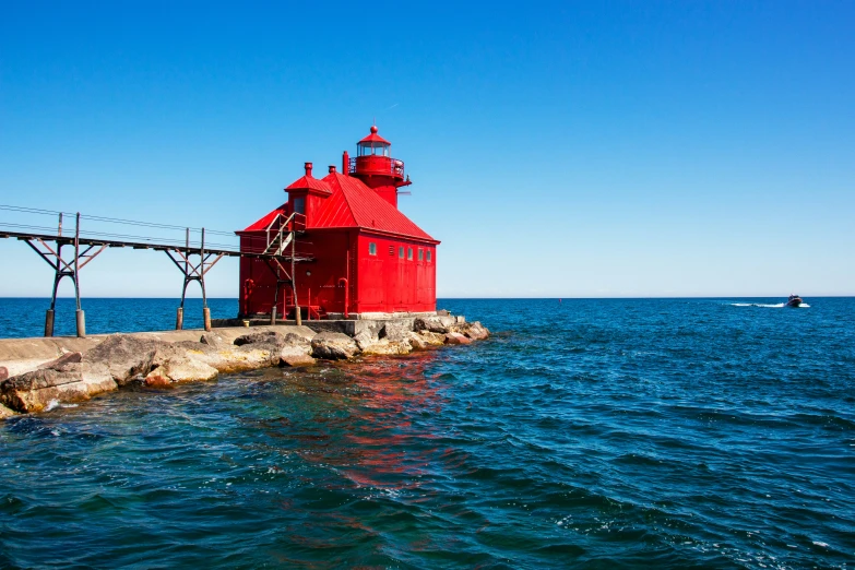 a lighthouse in the middle of the ocean