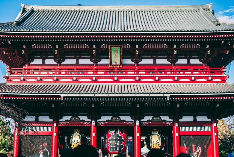 a pagoda with people standing next to it