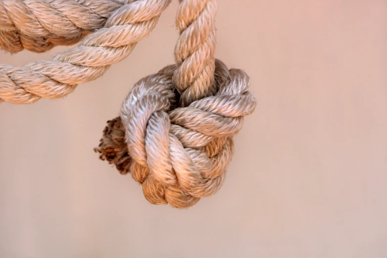 three ropes of yarn tied together in close up