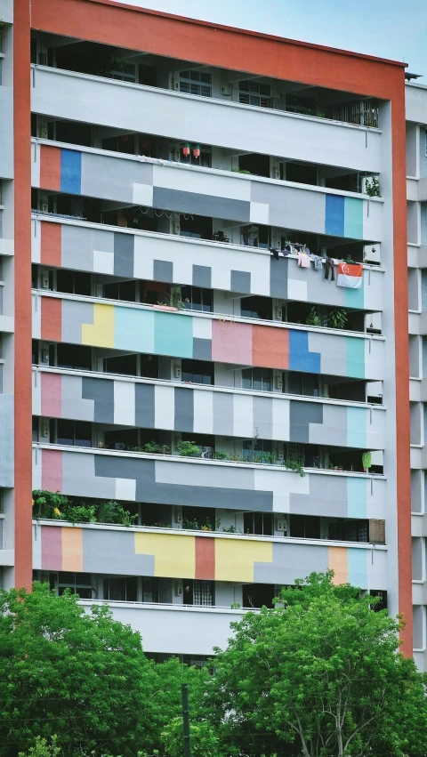 a multi - colored building in the city with a lot of windows