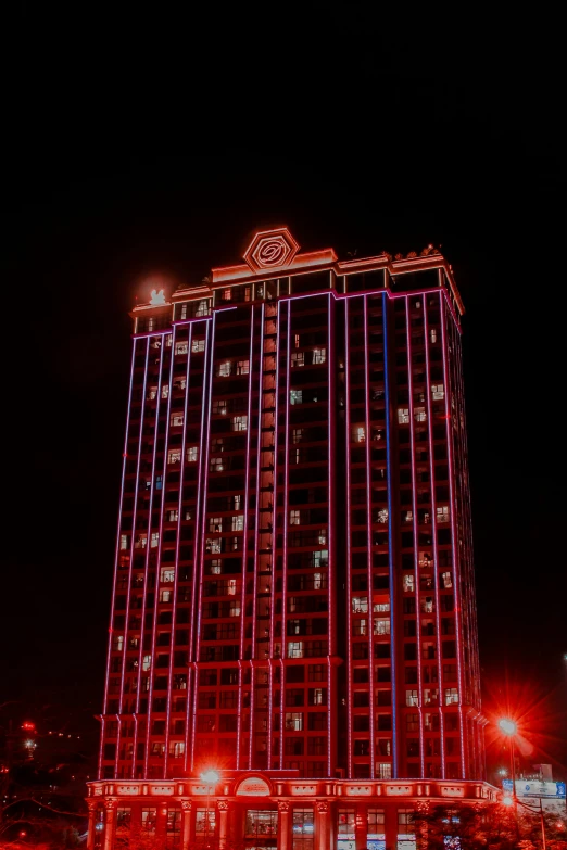 the night time picture shows a lit up building