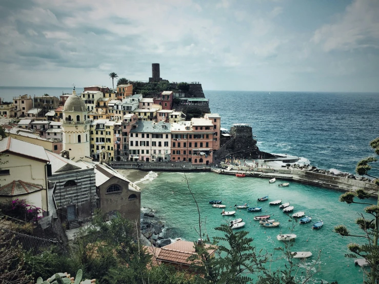 an ocean view with boats and buildings in the water