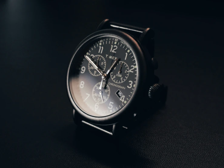 a close up of a watch on a table