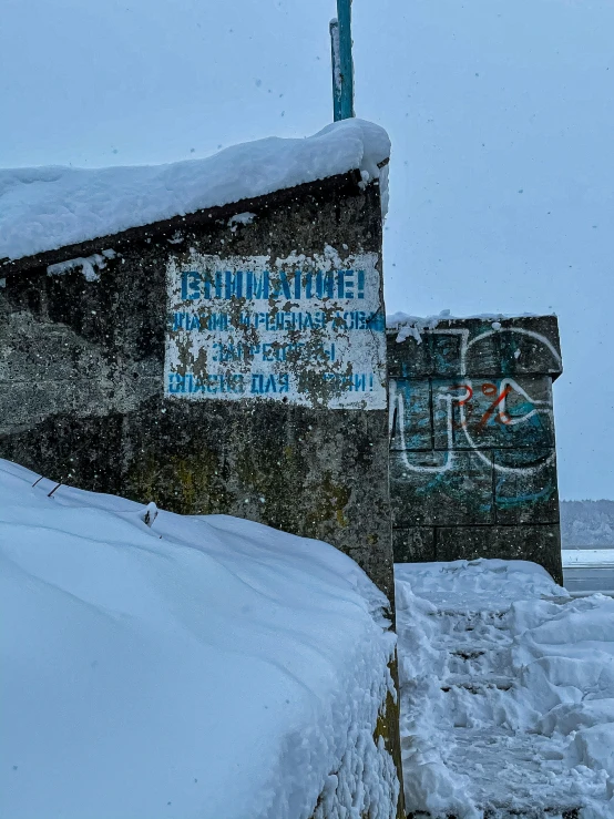 a building on the shore covered in snow