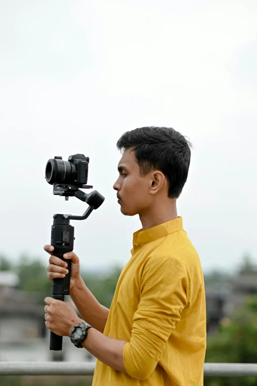 a man that is holding some kind of camera