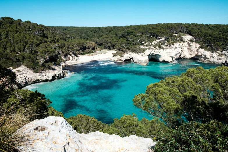 an ocean scene shows the blue waters near land