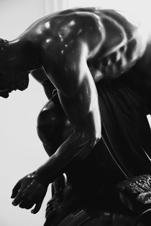 black and white po of man on marble statue