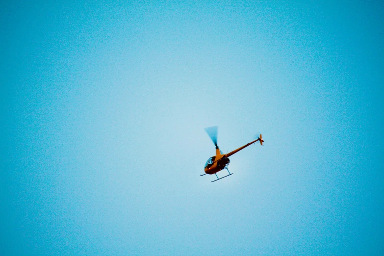 an airplane flying across a blue sky