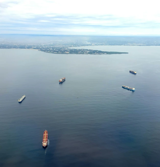 an image of several ships sailing in the ocean