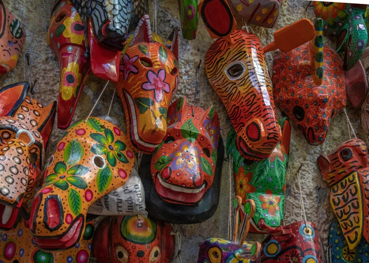 a colorful picture of masks on the wall