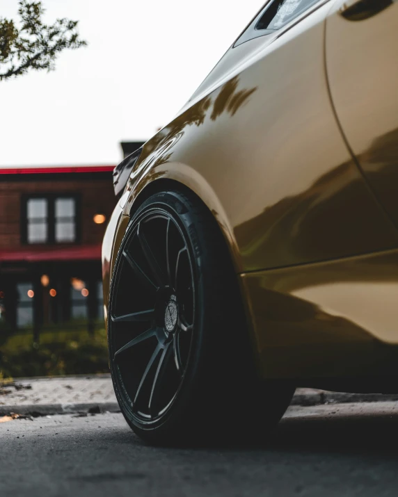 a brown vehicle parked on the side of a road