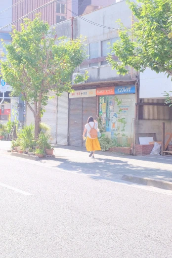 an older woman crossing the street in front of an empty market