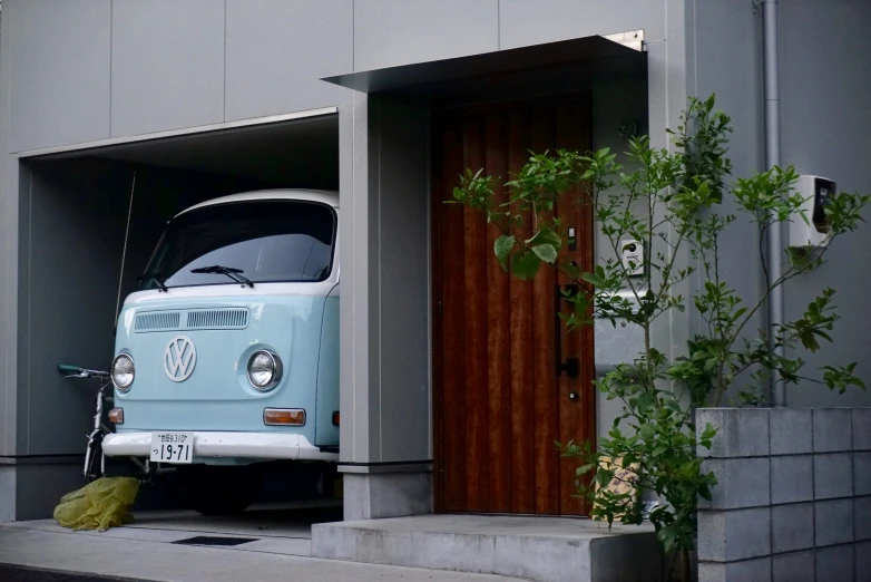 a van is parked outside of a house next to a door