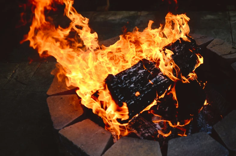 a black block on fire with flames burning on top of it