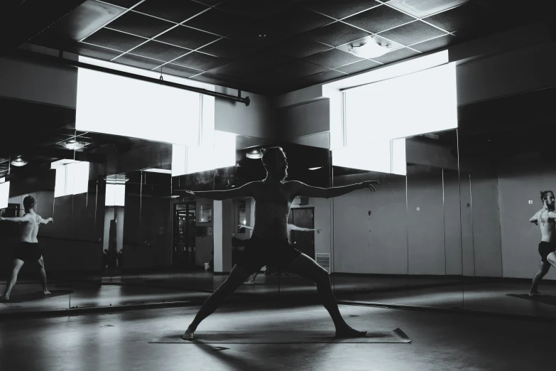 a woman standing in the middle of a room with a hula hoop on her head